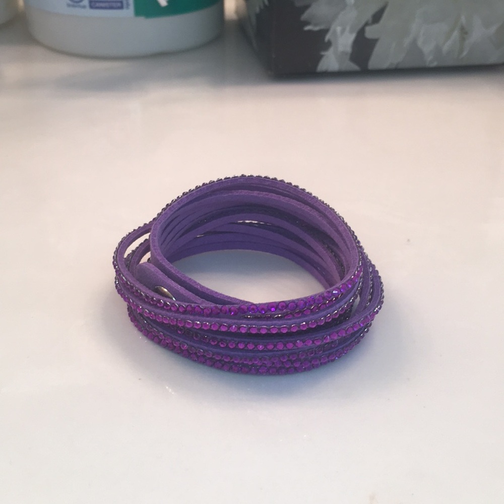A wraparound purple six strand rhinestone bracelet